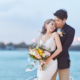 Bride and groom celebrating an intimate wedding ceremony at sea on a luxury boat