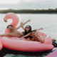 Guests having fun with water sports and inflatables during a Singapore boat charter