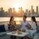 Friends enjoying drinks during a sunset cruise on a luxury yacht charter in Singapore